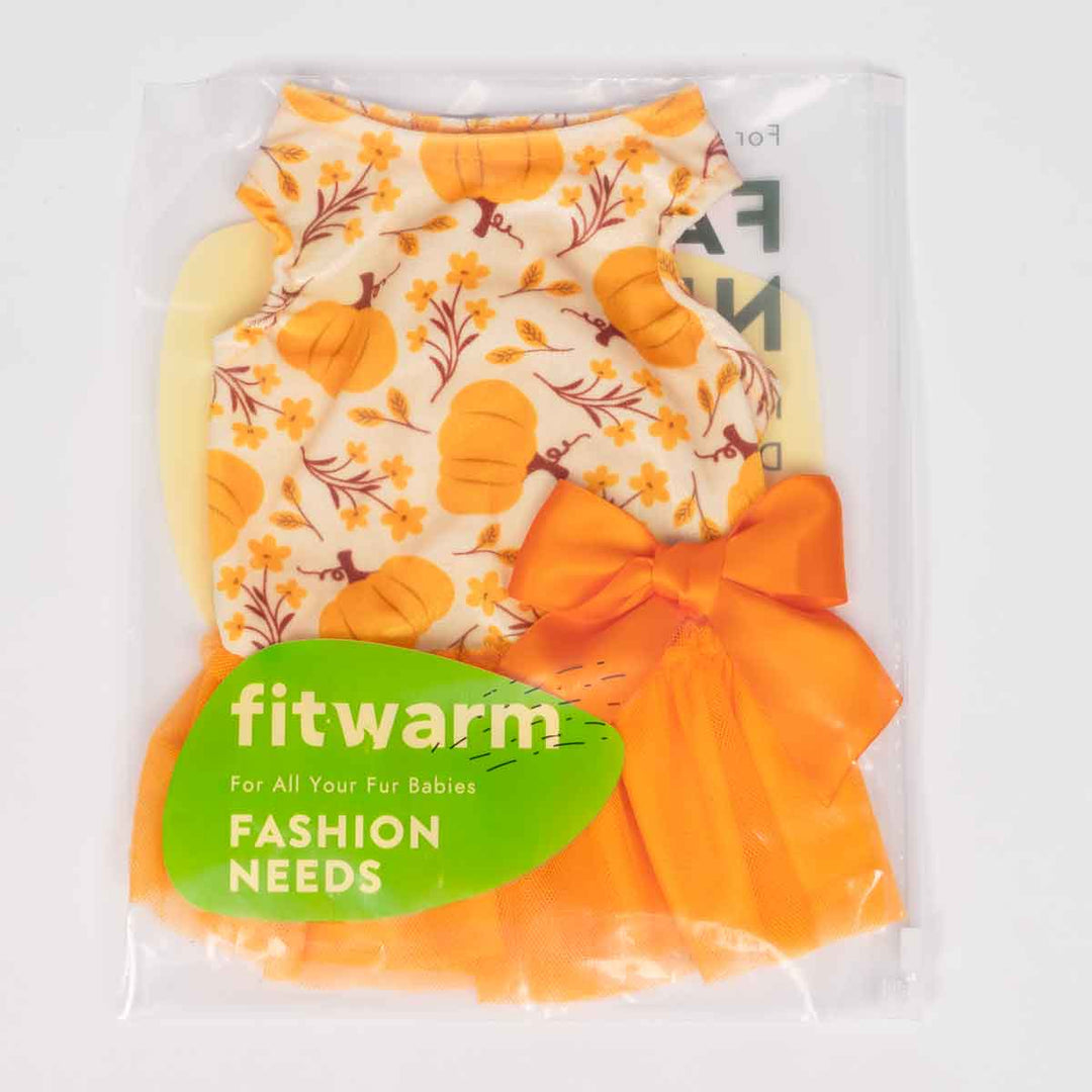 Dog dress with pumpkin pattern and orange bow in packaging labeled 'fitwarm'.