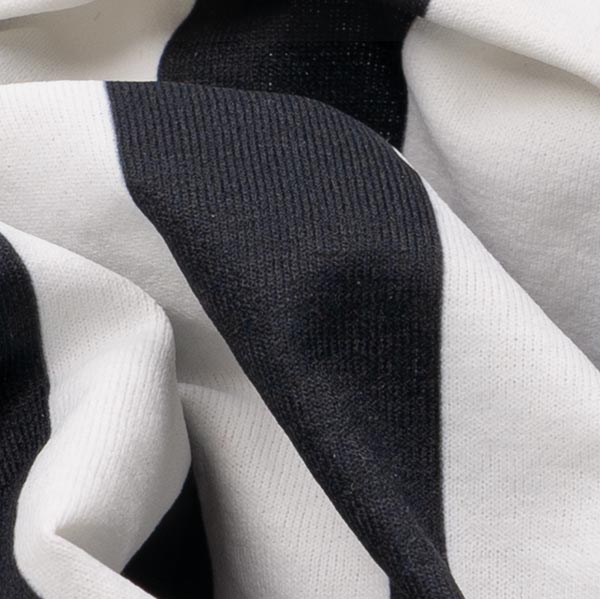 Fabric detail of dog shirt showing black vertical stripe pattern.