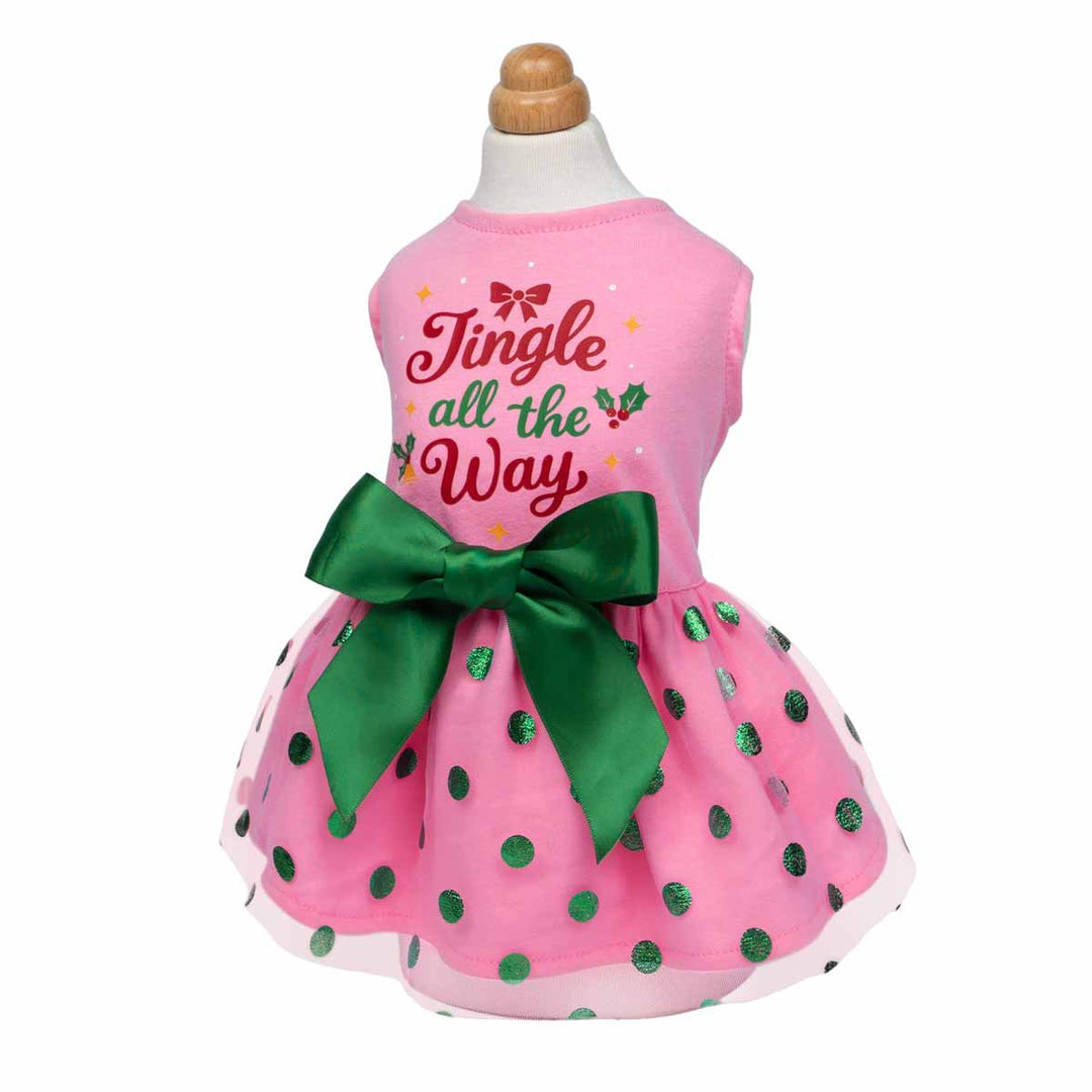 Holiday dog dress featuring green dots, green bow, and cheerful Christmas message print.