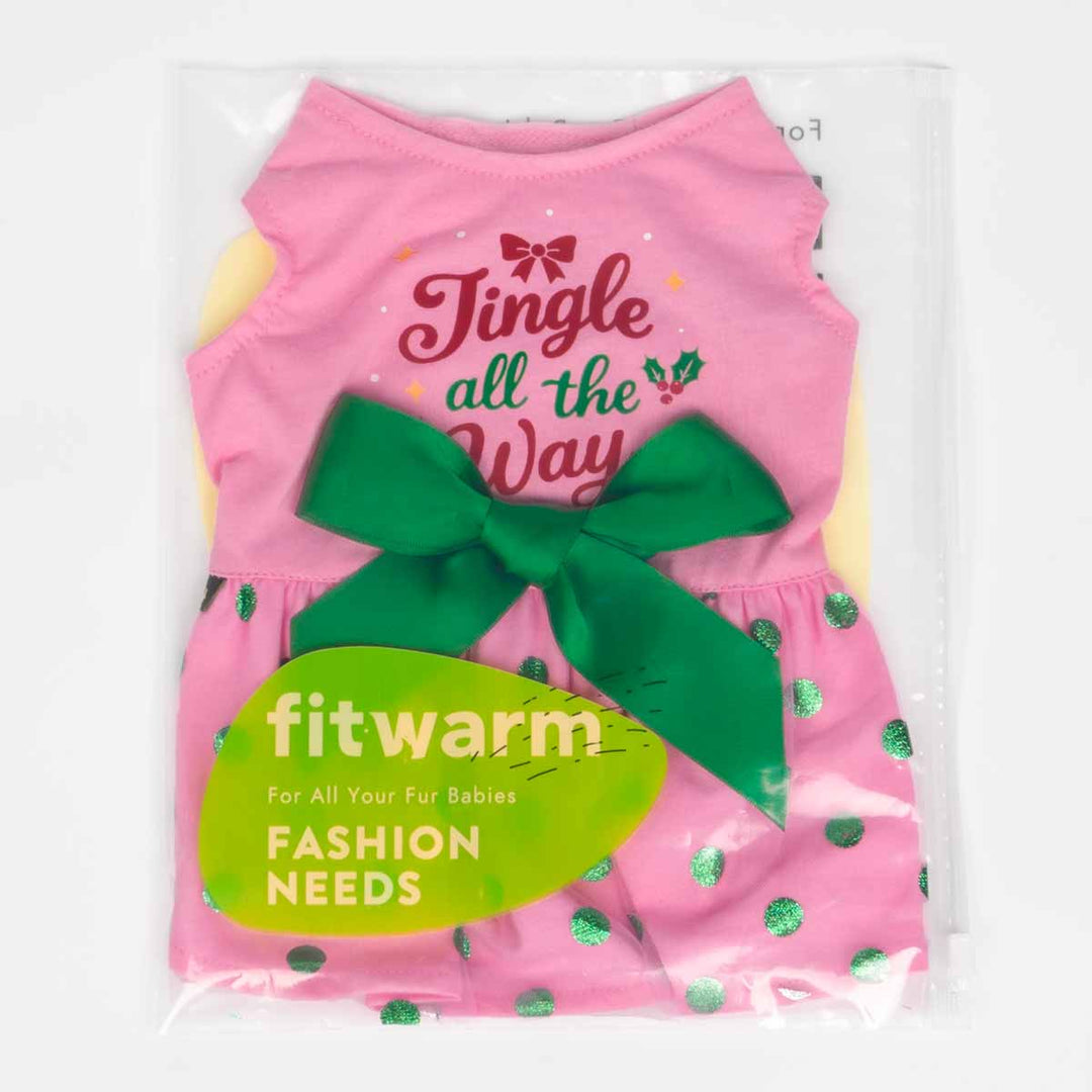 Dog dress in retail packaging with green bow and “Jingle all the Way” lettering visible.