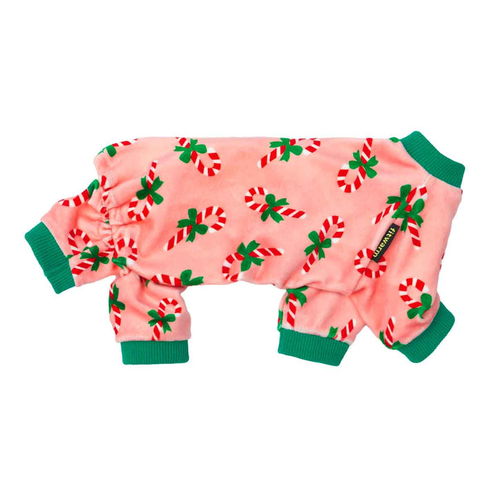 Soft pink dog pajamas decorated with holiday candy canes and festive accents.
