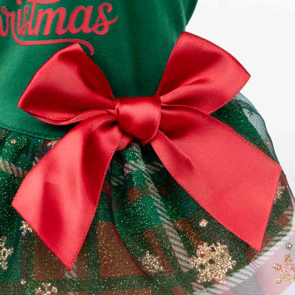 Close-up detail of Christmas dog dress with large red satin bow on plaid glitter skirt.