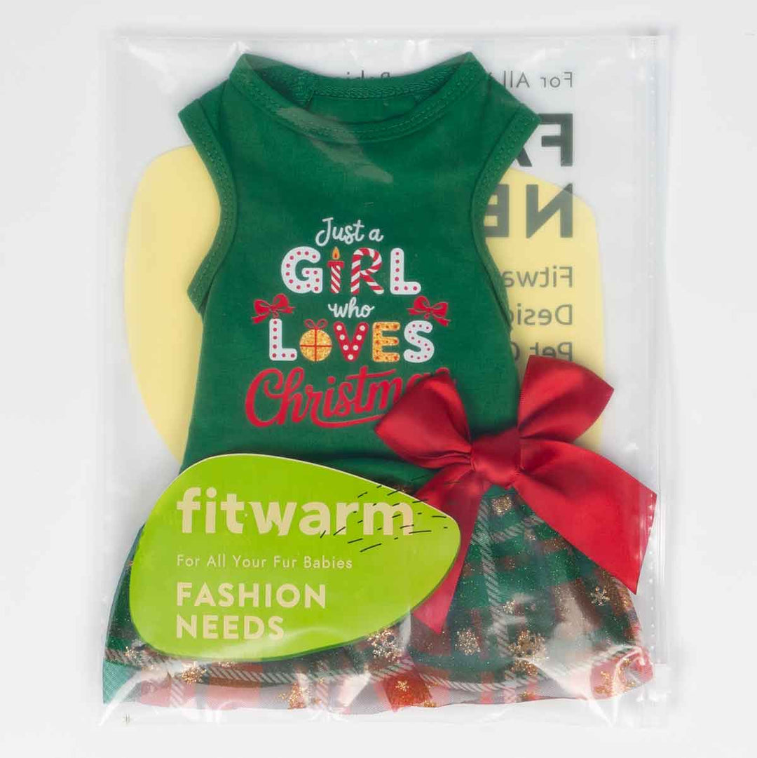 Packaged Christmas dog dress with green top, plaid glitter skirt, and red bow decoration.