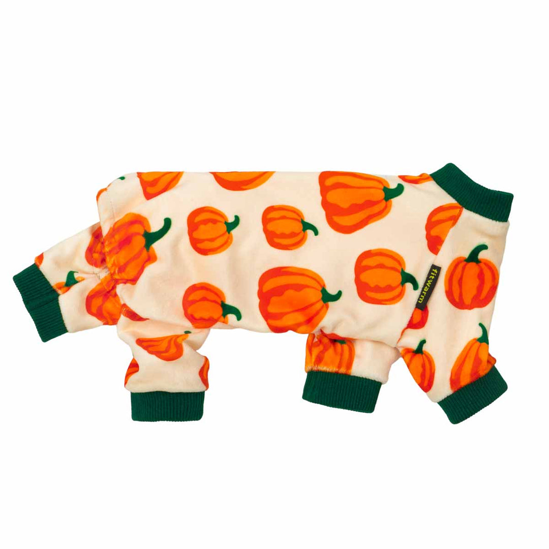 Side view of dog pajamas featuring bold pumpkin pattern and green trim.