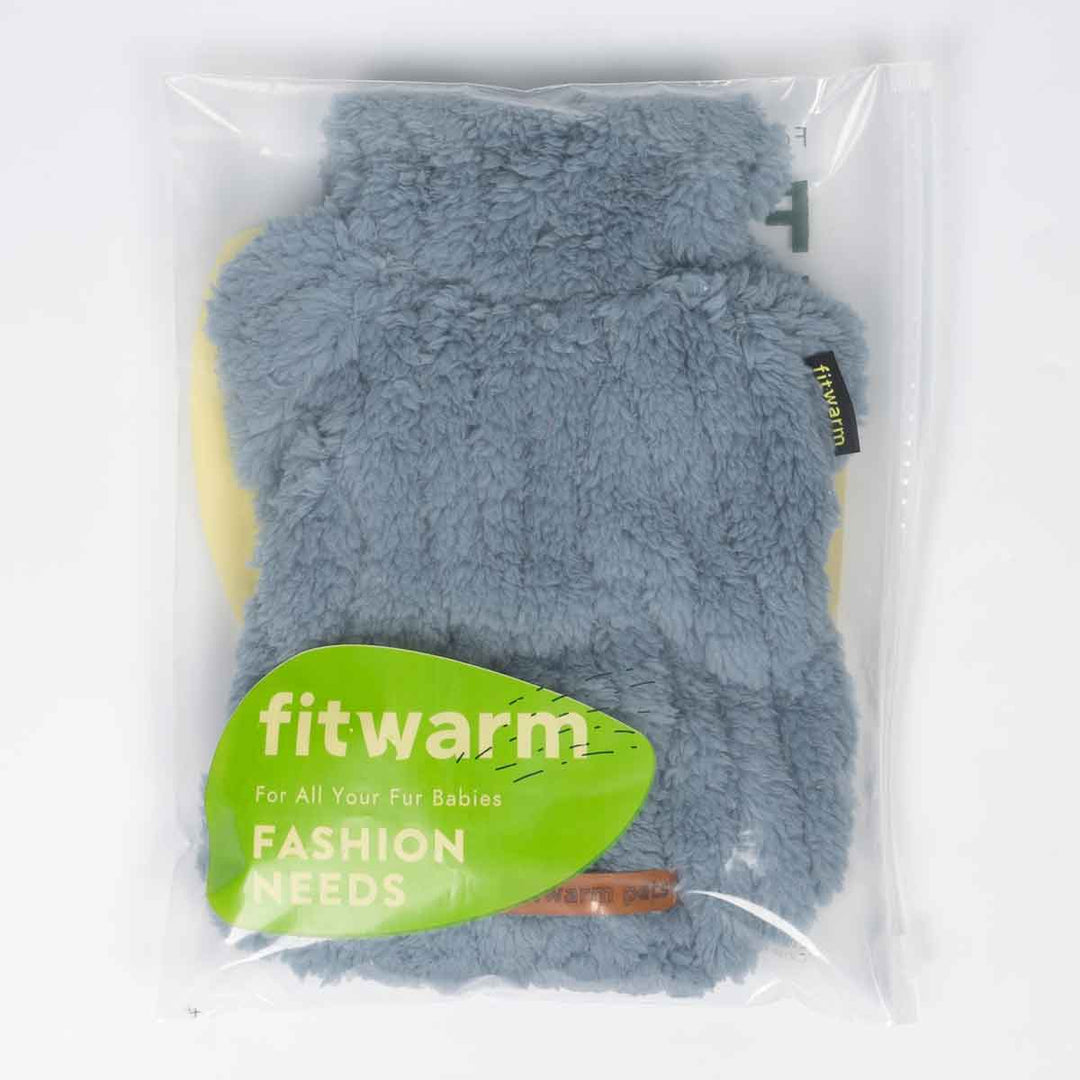 Blue sherpa fleece dog pajamas neatly packed in a clear Fitwarm-branded bag.