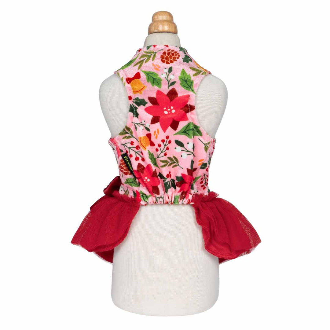 Back view of floral Christmas dog dress with red tulle skirt and sleeveless design.