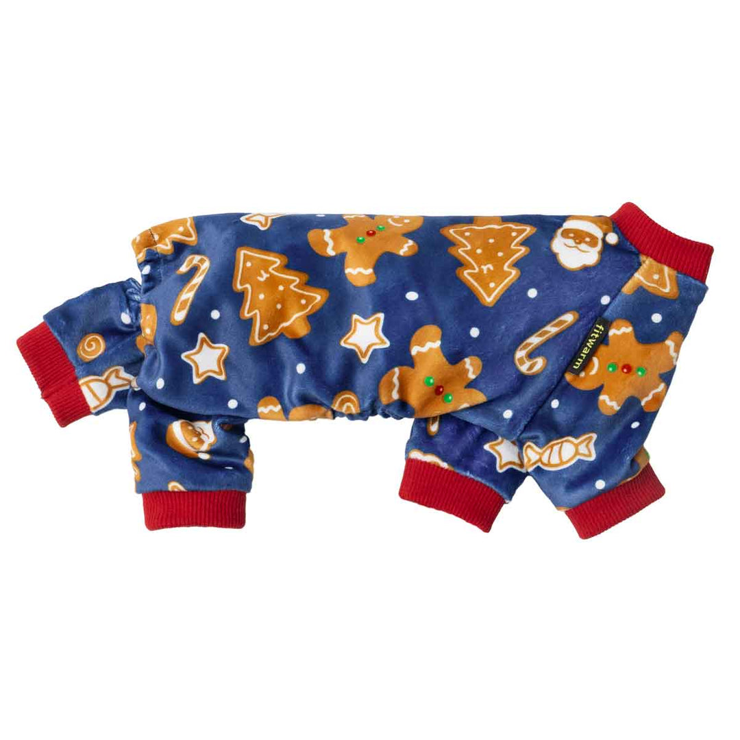 Side view of blue Christmas dog pajamas featuring gingerbread and candy prints with red cuffs.