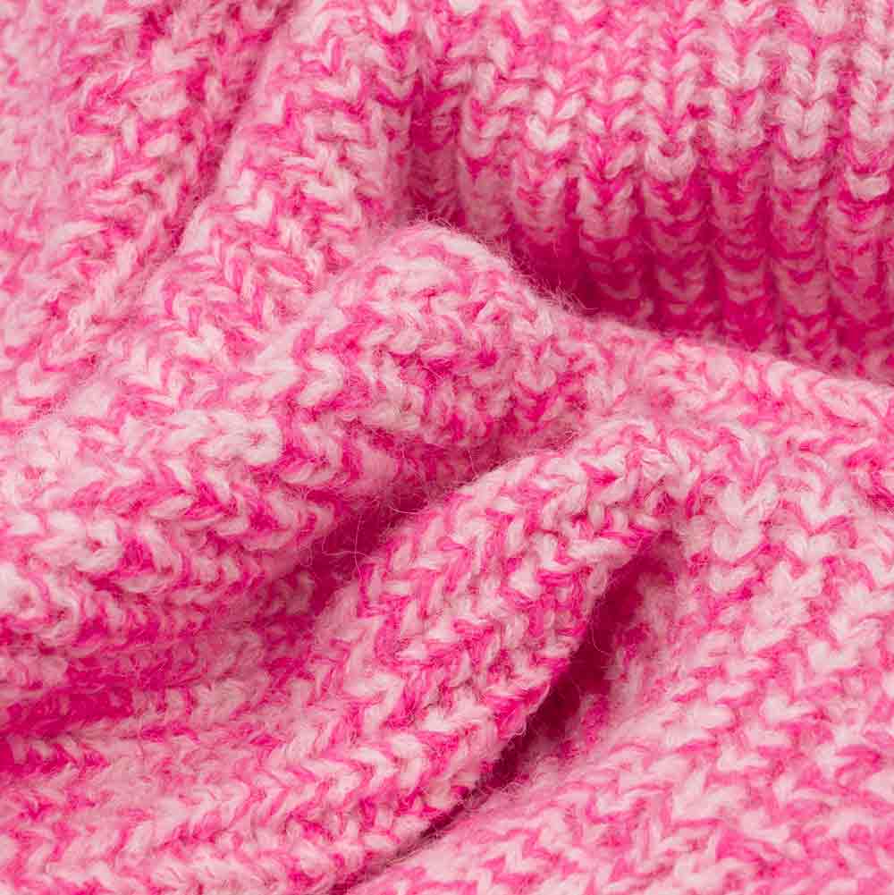 Close-up of pink and white polar fleece knit fabric from dog sweater, showing soft texture.