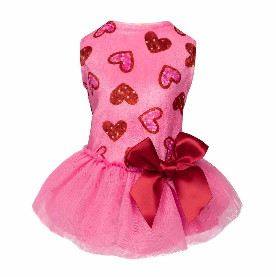 Pink dog dress with red sequin heart prints, featuring a tulle skirt and large satin bow.