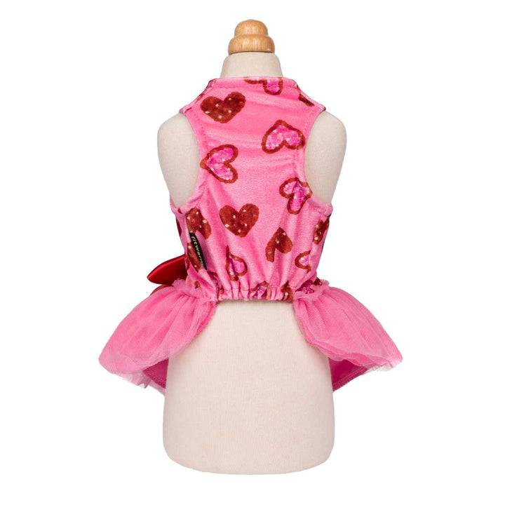 Back view of pink dog dress with sequin heart prints and elastic waist, designed with a flared tulle skirt.