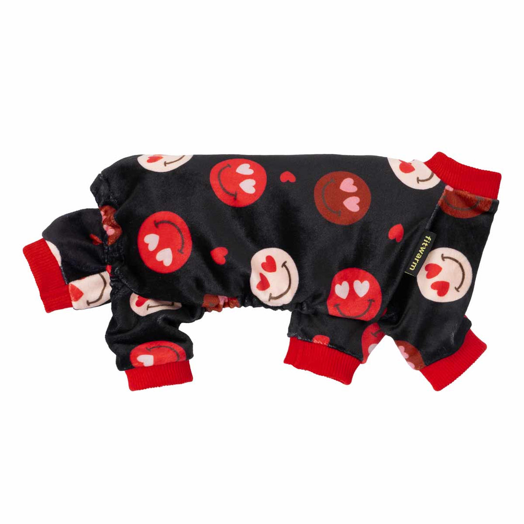 Side view of dog pajamas with black fabric and red heart-eyes emoji pattern.