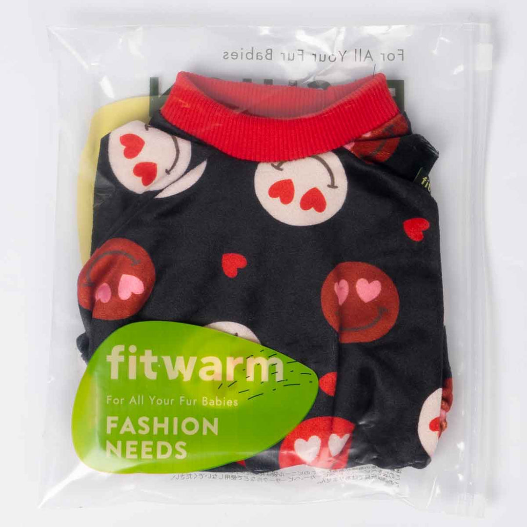 Packaged dog pajamas featuring black fabric with cute heart-eye smiley prints.