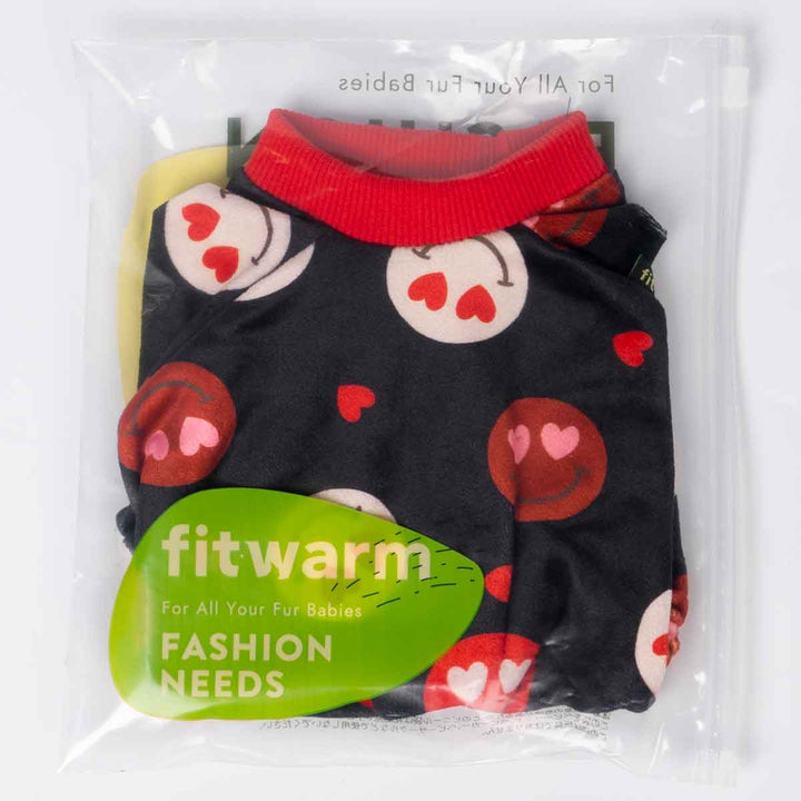 Packaged dog pajamas featuring black fabric with cute heart-eye smiley prints.