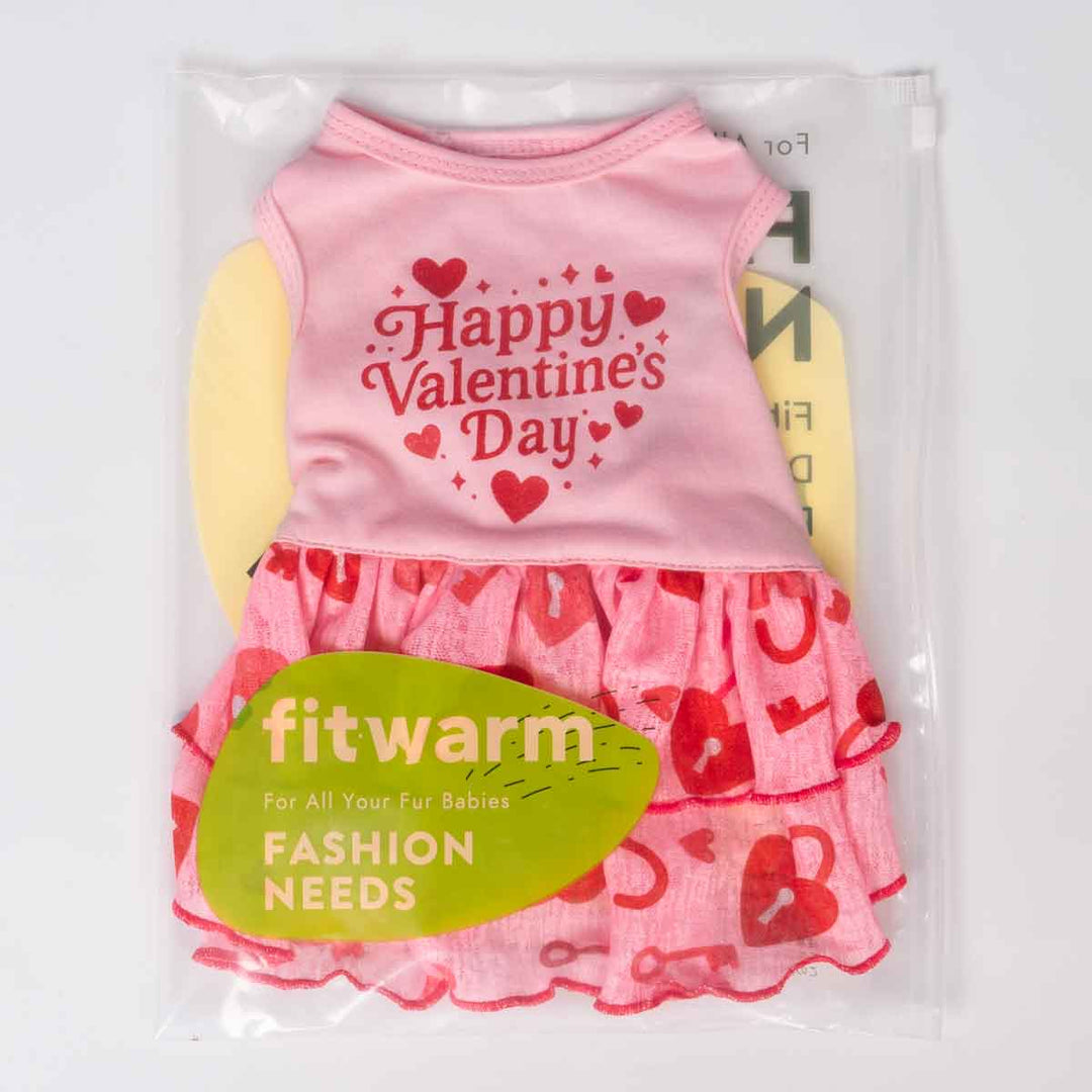 Packaged pink Valentine dog dress featuring heart and lock prints and a ruffled skirt.