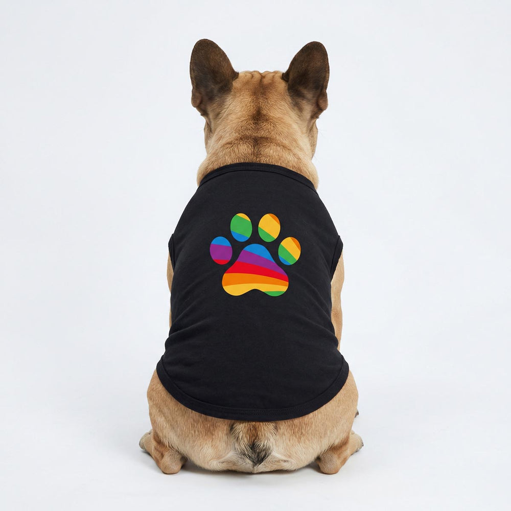 French Bulldog wearing a dog tank top with colorful rainbow paw prints, looking from back side