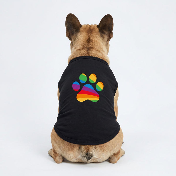 French Bulldog wearing a dog tank top with colorful rainbow paw prints, looking from back side
