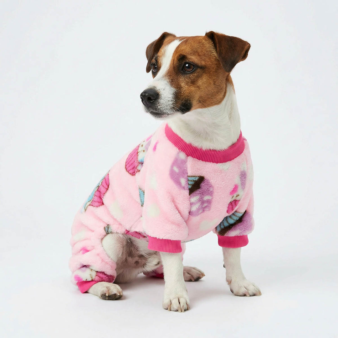 Jack Russell wearing a cozy dog fleece pajamas with cupcake prints