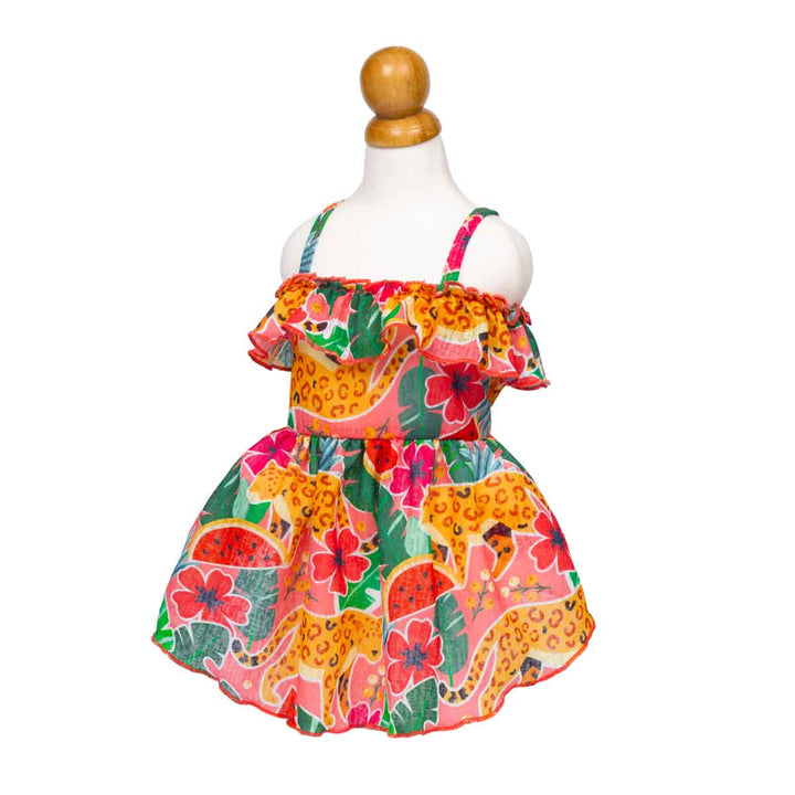 Colorful summer dress for dogs with tropical fruit and animal print on a mannequin against a white background