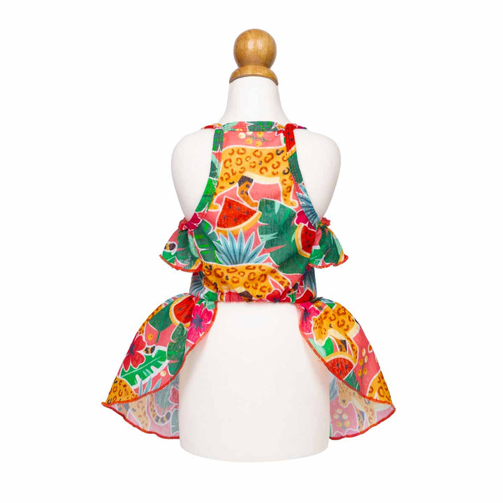 Colorful dog Hawaiian dress with tropical patterns on a mannequin against a white background