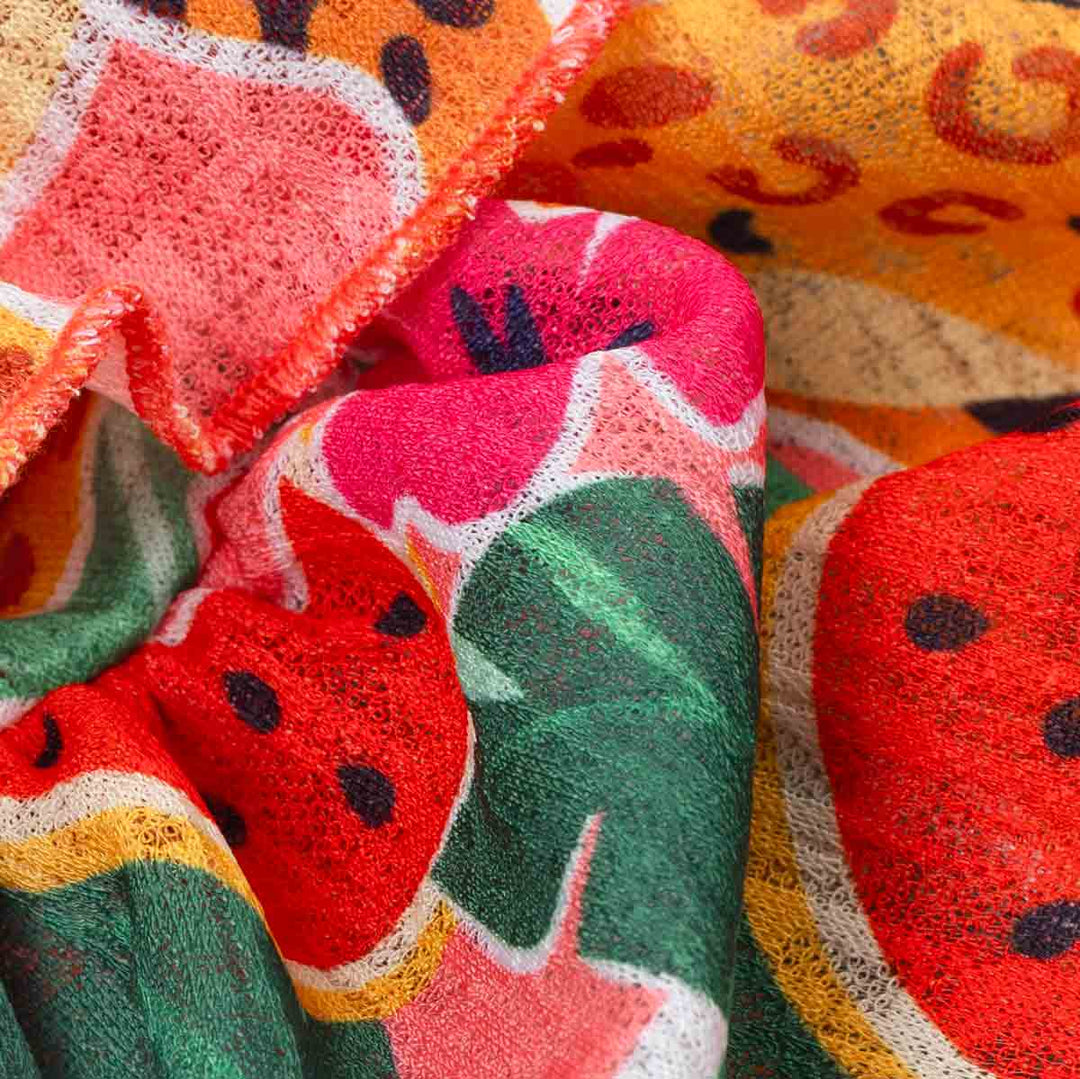 Colorful fabric with watermelon pattern on a textured background