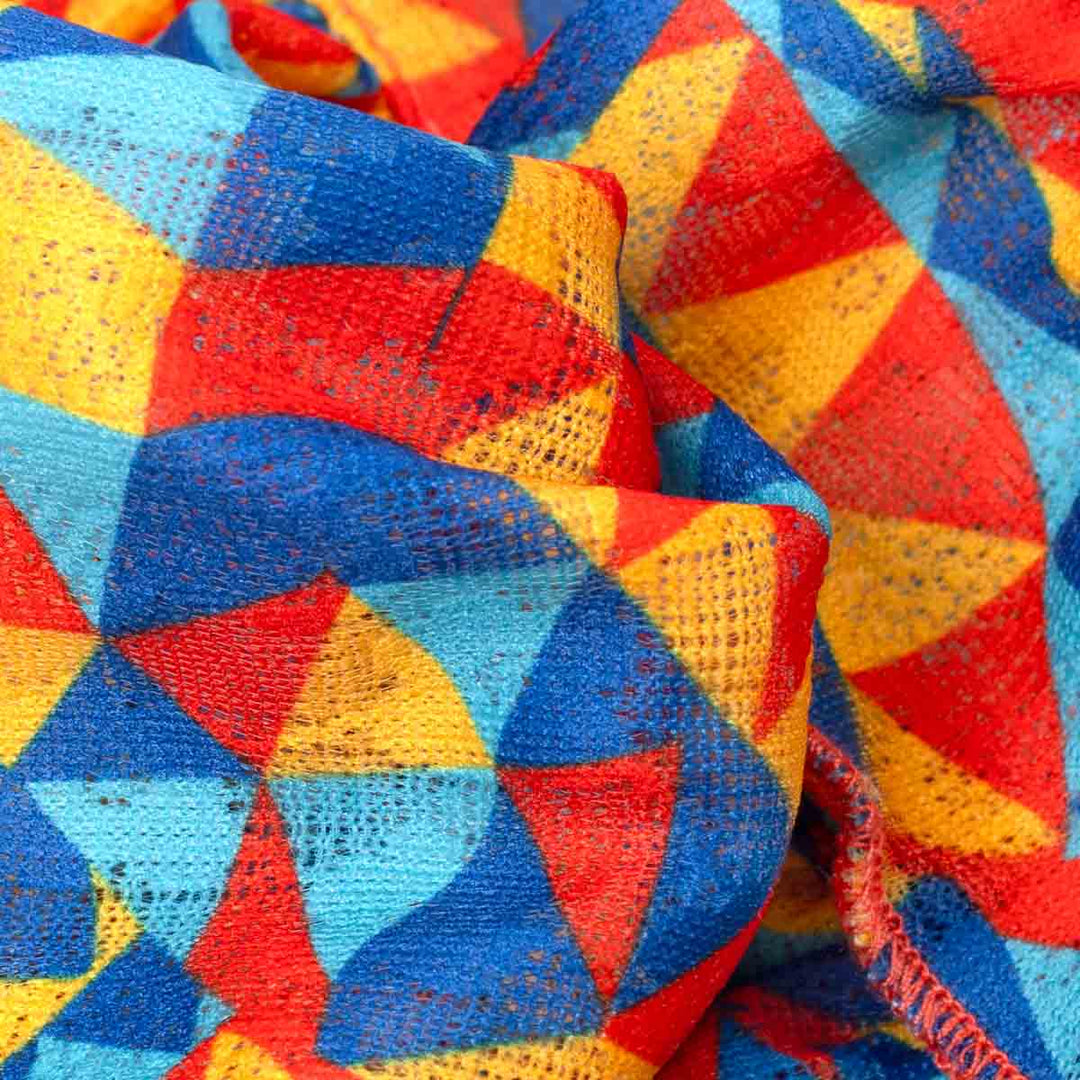 Close-up of colorful fabric with red, yellow, and blue pattern