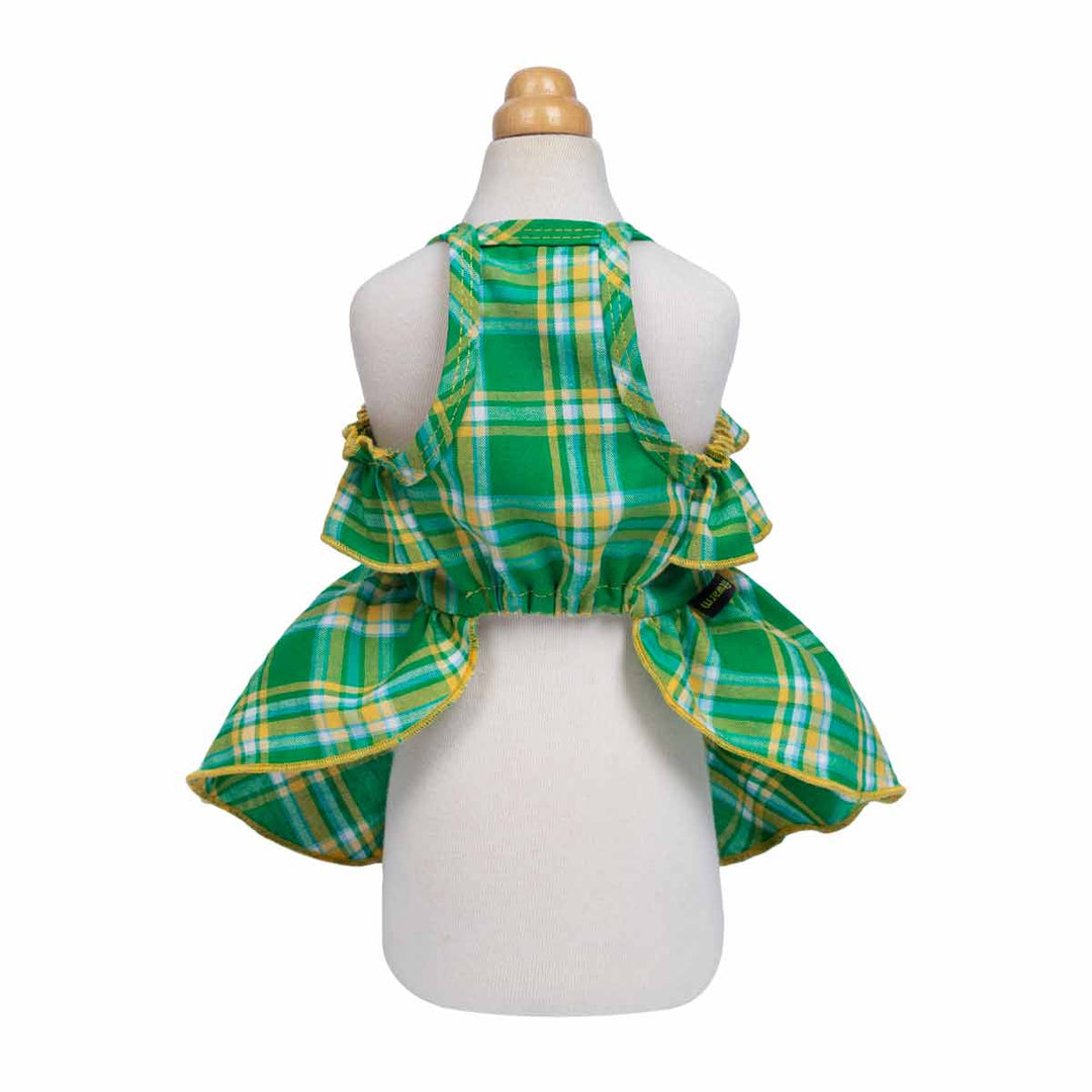 Green and yellow plaid dog dress on a mannequin with a white background