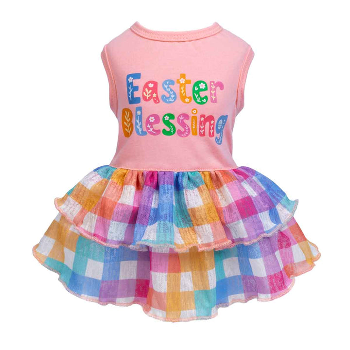 A colorful plaid dog dress with a pink top and rainbow ruffled skirt.