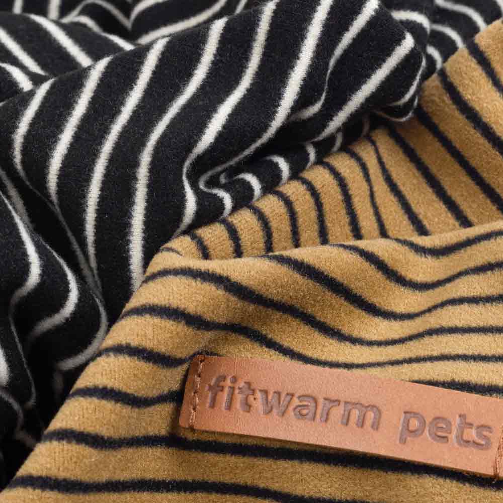 Close-up of soft striped lightweight velvet fabric in black and tan colors used for dog pajamas.