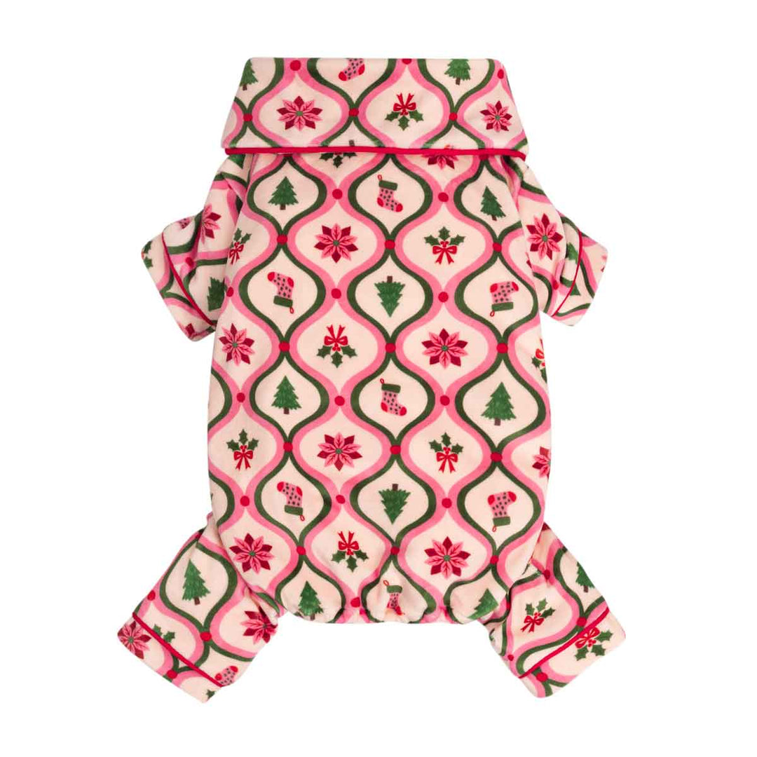 Small dog pjs with a festive holiday print, featuring a pink and cream background with green and red Christmas motifs including poinsettias, holly, candy canes, and Christmas trees