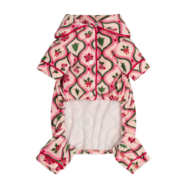 Small festive pajamas for dogs with a festive Christmas print, featuring pink and cream geometric patterns with green holly leaves and red bows, and a white plush lining