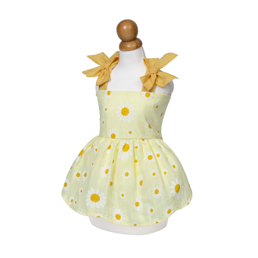 Yellow dog dress with daisy pattern on a mannequin against a white background