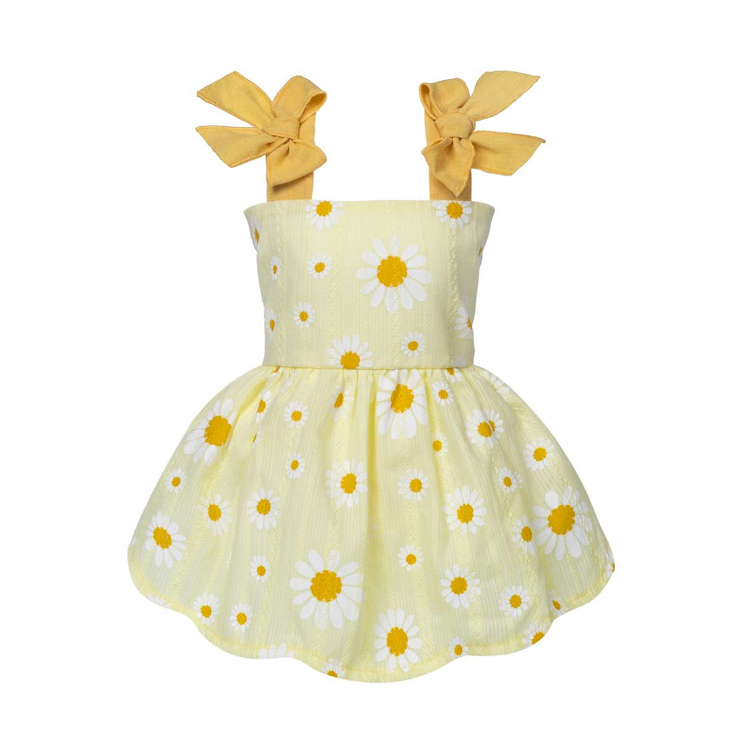 Yellow dress for dogs with daisy pattern and bow straps on a white background
