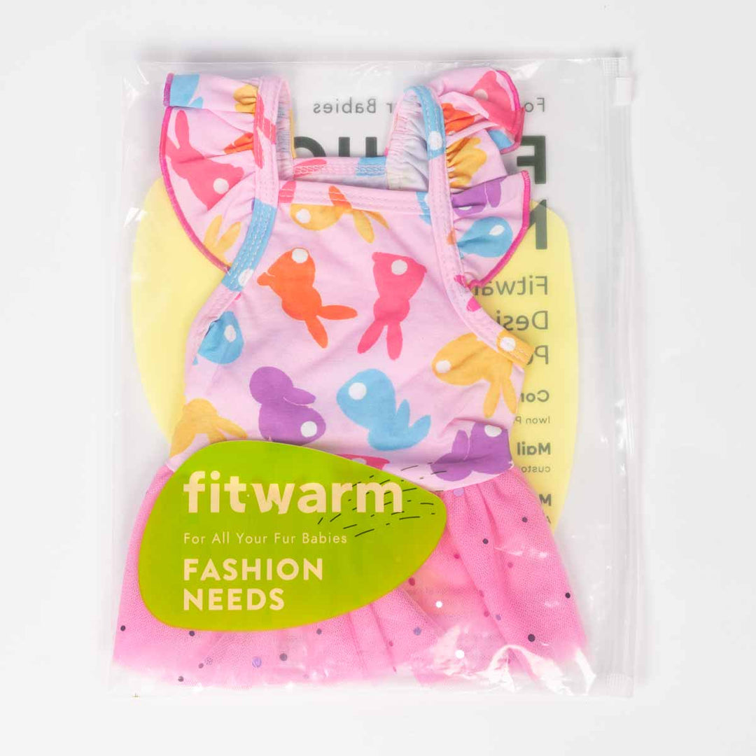 Dog dress in packaging, featuring a pink base with colorful bunny designs and a tutu skirt.