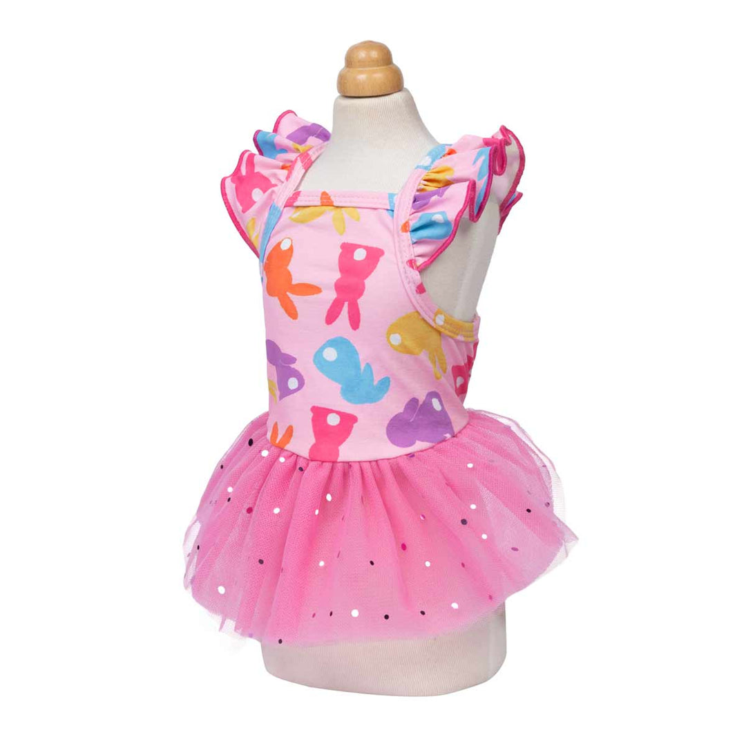 Front view of a dog dress with playful bunny prints, ruffled straps, and a fluffy tulle skirt.