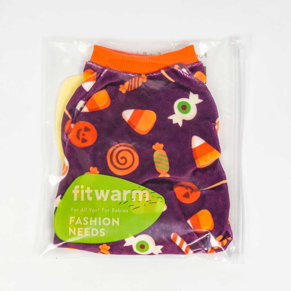 Packaged purple dog pajamas with orange trim, featuring playful Halloween candy corn and swirl prints.