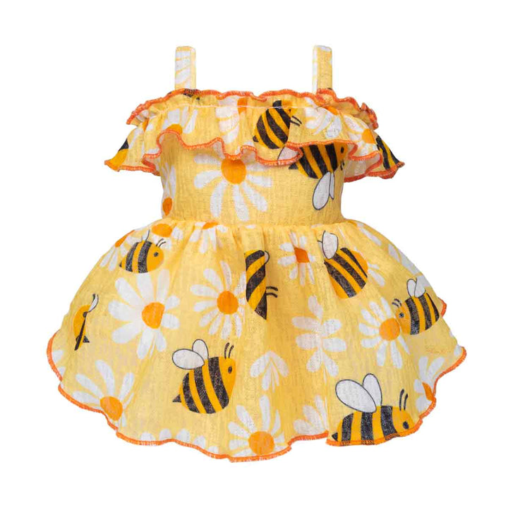Yellow dog dress with bee and flower pattern on a white background