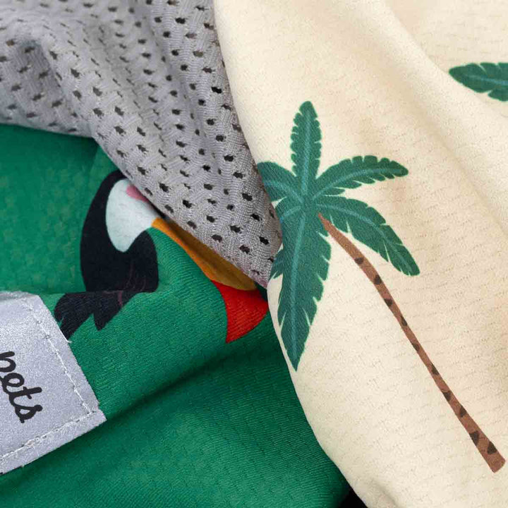 Close-up of fabric with toucan and palm tree design