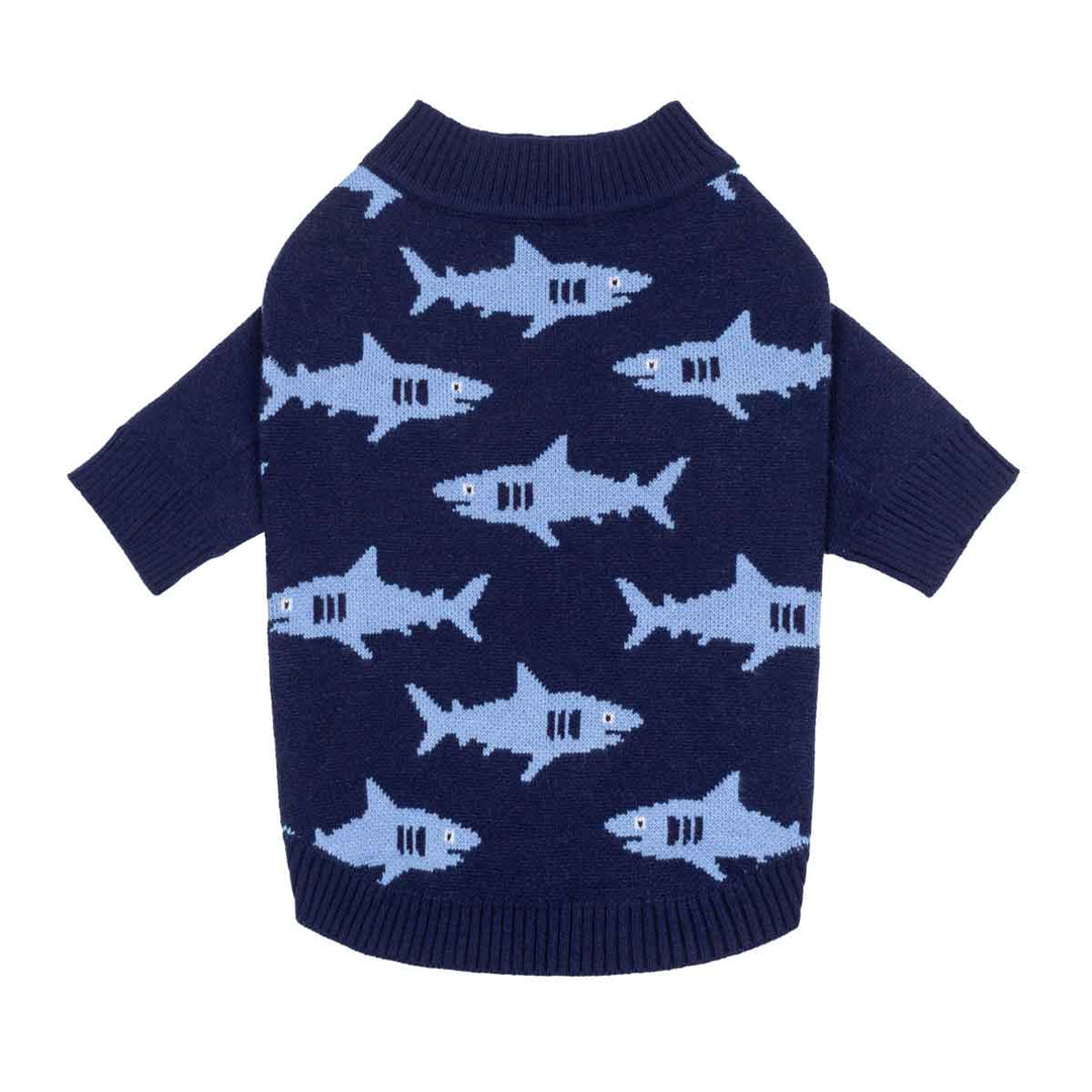 Navy blue knit sweater for dogs with a light blue shark pattern, featuring short sleeves and a ribbed collar, cuffs, and hem, shown against a plain white background