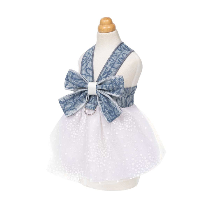 White dress for dog with denim bow and d ring on a mannequin against a white background