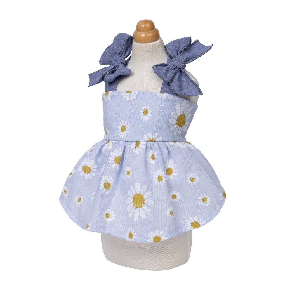 Adorable dress for dogs with daisy pattern and blue bows on a mannequin against a white background