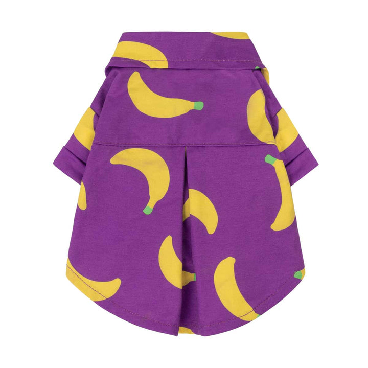 Purple dog tshirt with yellow banana patterns on a white background