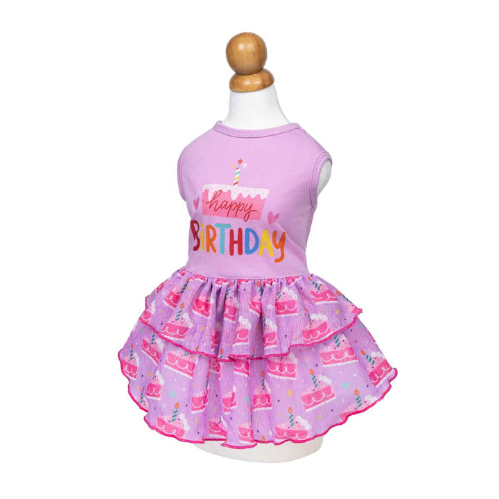 Purple dog birthday dress on a mannequin with a white background