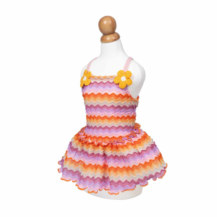 Colorful striped dress for dogs with floral accents on a mannequin against a white background