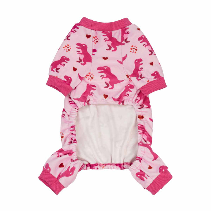 Pink dog pjs featuring a dinosaur print on the outside and a soft white fleece lining, shown on a plain white background