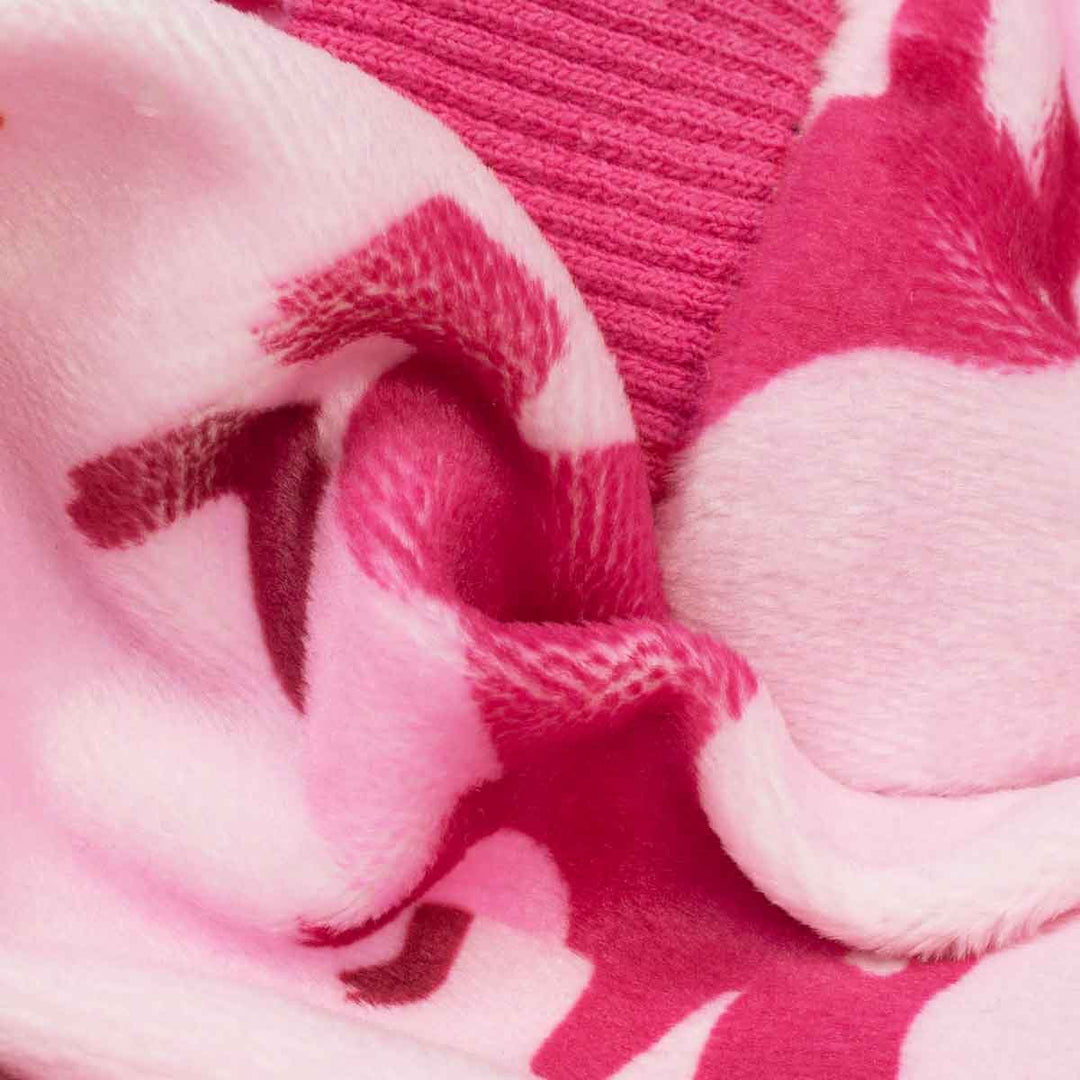 Close-up of a soft fabric with a pink and white pattern