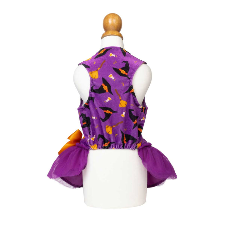 Purple sleeveless dog tutu with a Halloween print of black witch hats and orange brooms, displayed on a white mannequin torso with a purple tutu skirt and orange bow