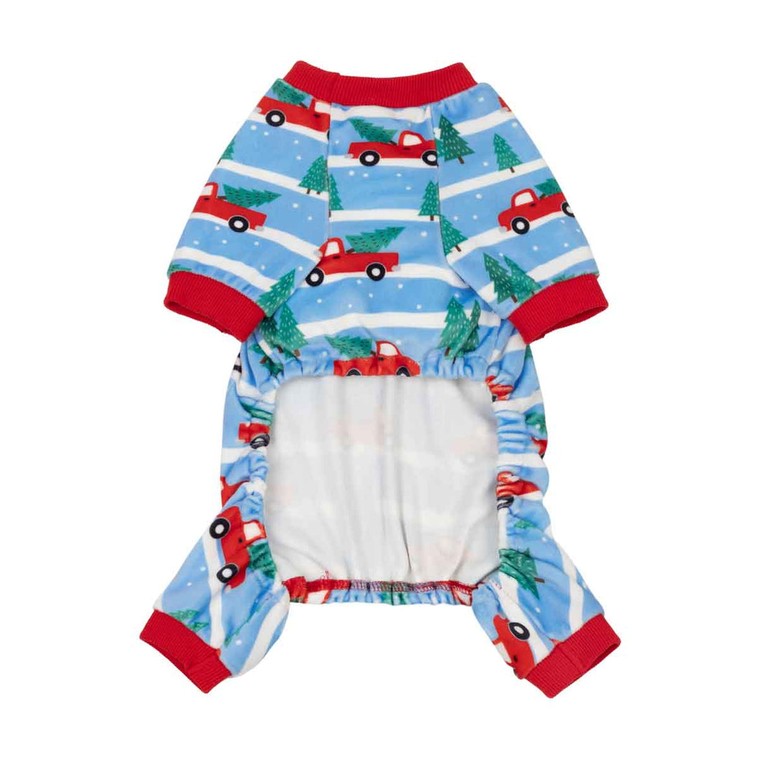 Small dog onesie with a festive Christmas print featuring red trucks, green trees, and white stripes on a light blue background
