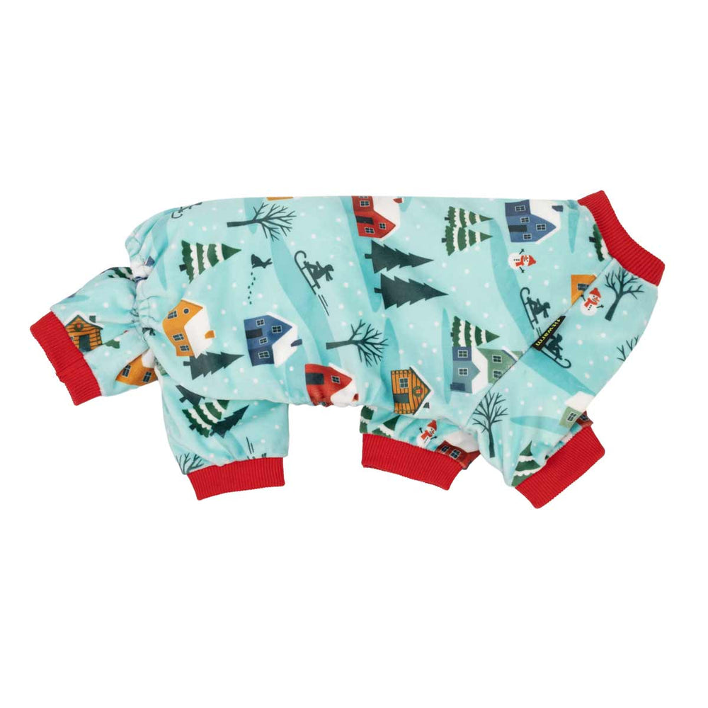 Christmas fleece dog pjs featuring a light blue winter village print with red ribbed cuffs and collar, shown on a plain white background