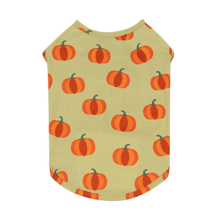 Sleeveless dog tank top with an all-over pumpkin print on a light beige background, shown flat against a white background