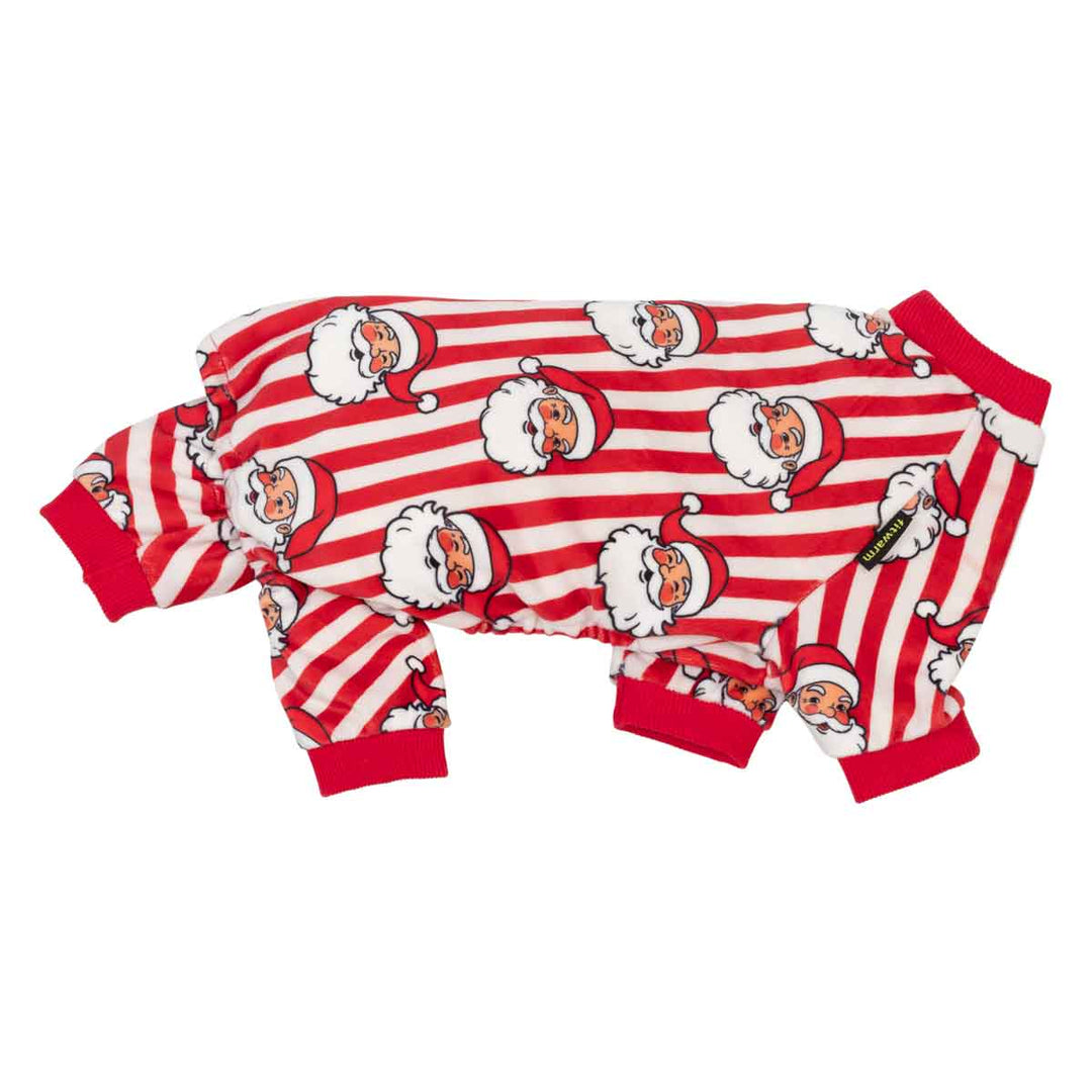 Side view of Christmas dog pajama featuring red and white horizontal stripes with a repeating cartoon Santa Claus face print, red cuffs, and a red collar, shown on a plain white background